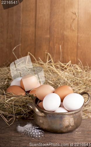 Image of eggs on old wooden background