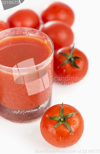 Image of Glass of tomato juice and tomatoes