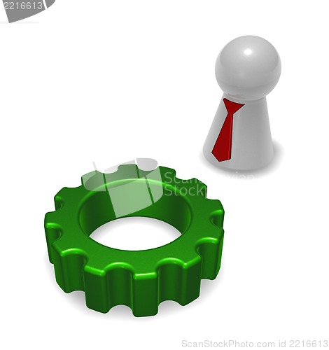 Image of gear wheel and token