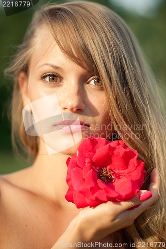 Image of young sexy girl with red flower #2