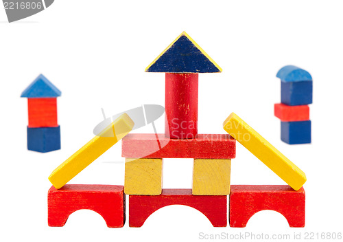 Image of colorful wood toy brick construction on white 