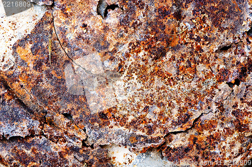 Image of uneven cracked tin rust stains background 