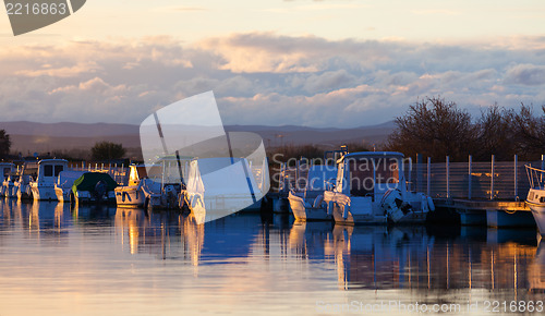 Image of Boats in a marina at sunset