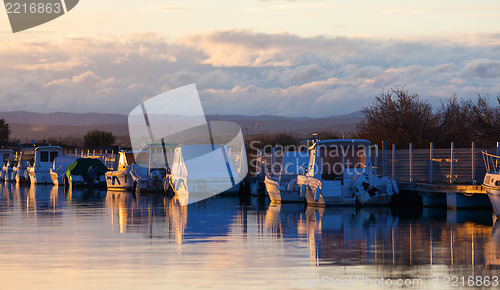 Image of Boats in a marina at sunset