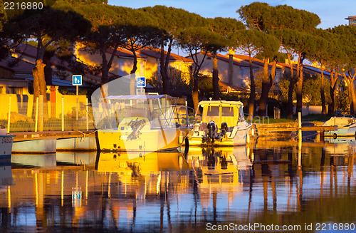 Image of Boats in a marina at sunset