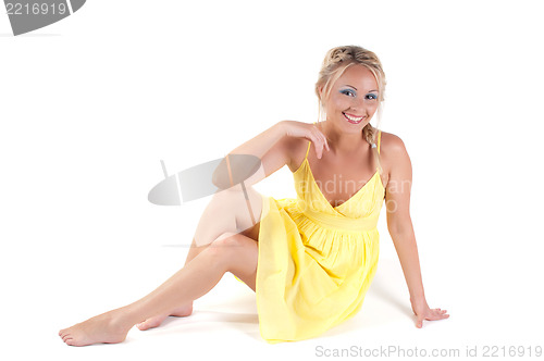 Image of Shot of beautiful woman in yellow dress