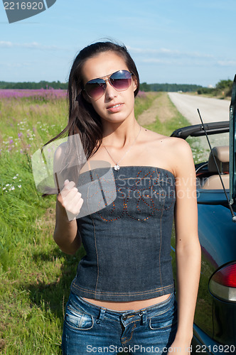 Image of Beautiful brunette woman ib sunglasses