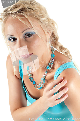 Image of Beautiful woman on blue watching on you
