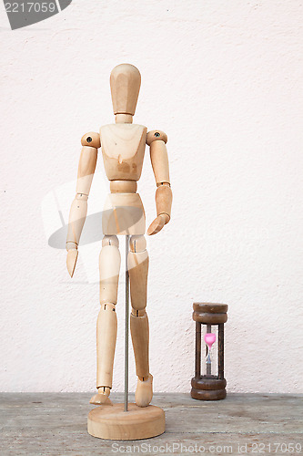 Image of Wooden mannequin pose in concept of progress time  