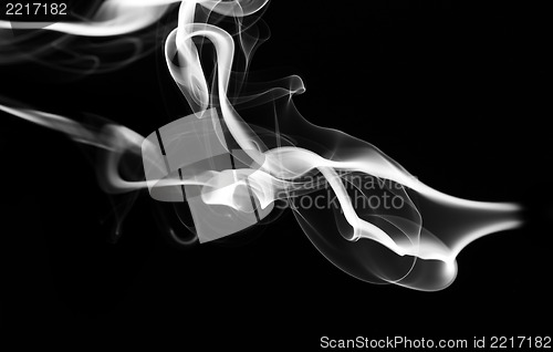 Image of Abstract white fume pattern and shape on black
