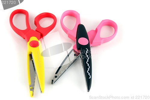 Image of Brightly colors craft scissors on a white background