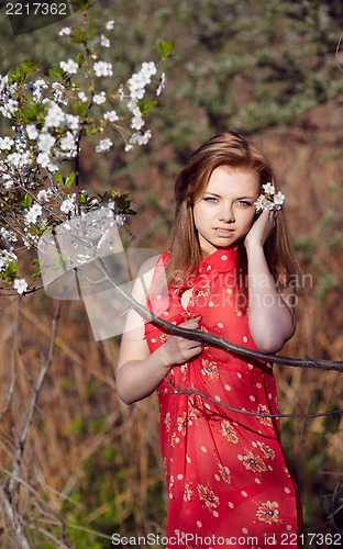 Image of Girl lying on a log