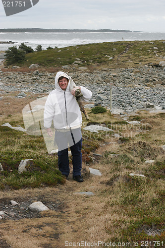 Image of Man collecting wood