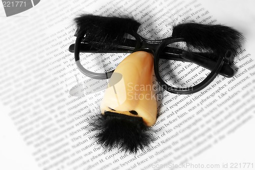 Image of Face Mask on Text