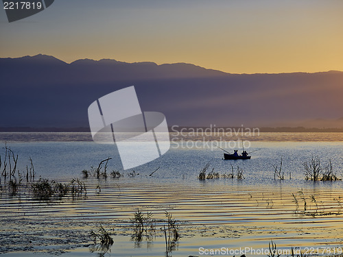 Image of The first rays of the sun and fishermen