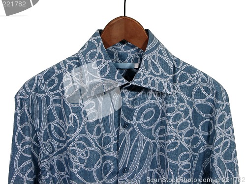 Image of Blue shirt on wooden hanger, white background