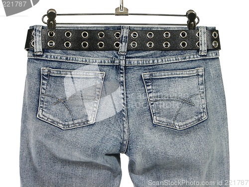 Image of Closeup of blue jeans with leather belt