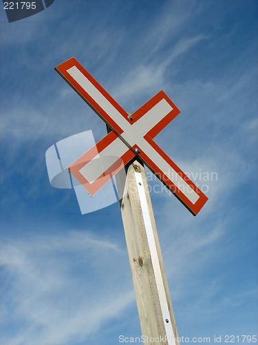 Image of Railroad crossing sign on a blue sky background