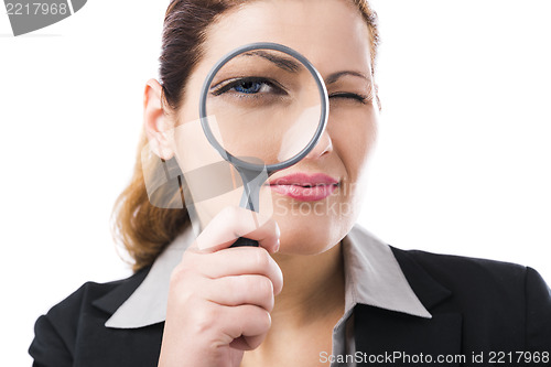 Image of Business holding a magnifying glass