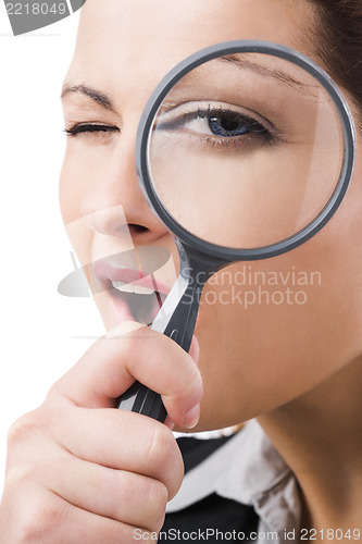 Image of Business holding a magnifying glass