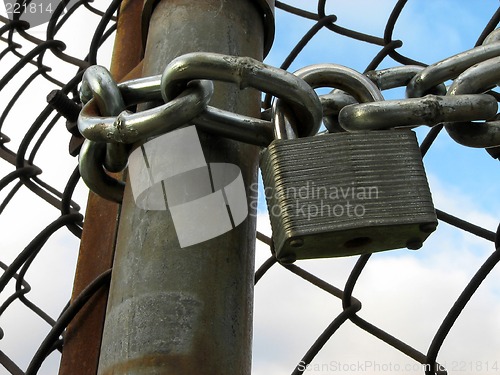 Image of Lock, chains and chain link fence