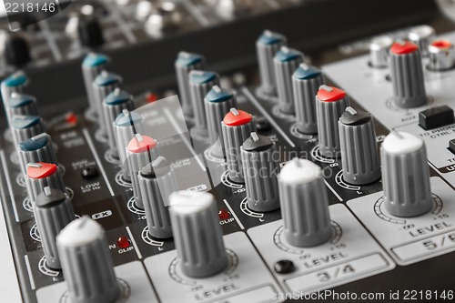 Image of Detail of a music mixer in studio