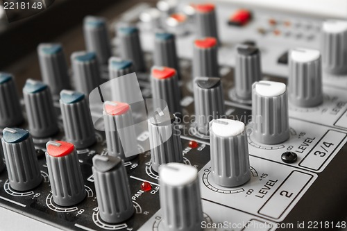 Image of Detail of a music mixer in studio