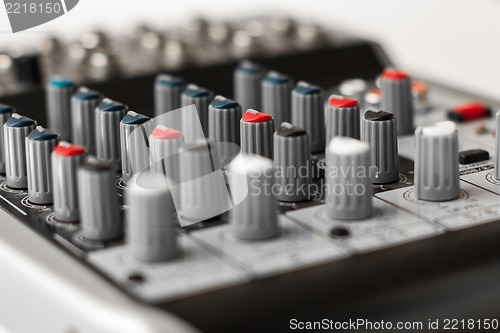 Image of Detail of a music mixer in studio