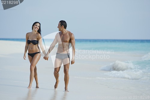 Image of Couple enjoying on the beach