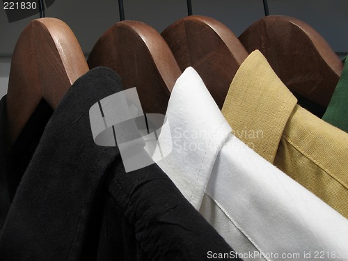 Image of Shirts on wooden hangers