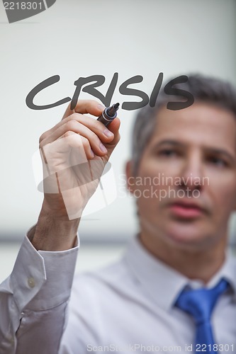 Image of Businessman writing with a felt tip pen