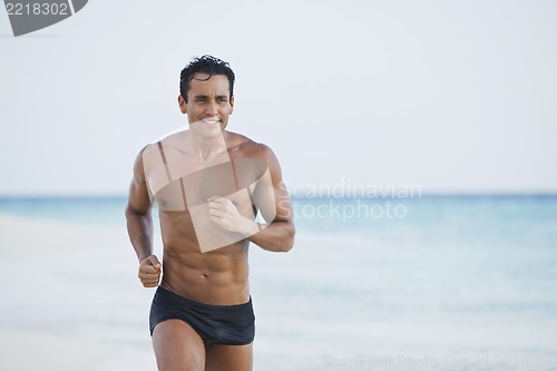 Image of Man running on the beach