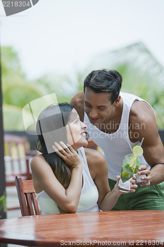 Image of Romantic couple having drinks