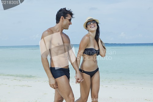 Image of Couple enjoying on the beach