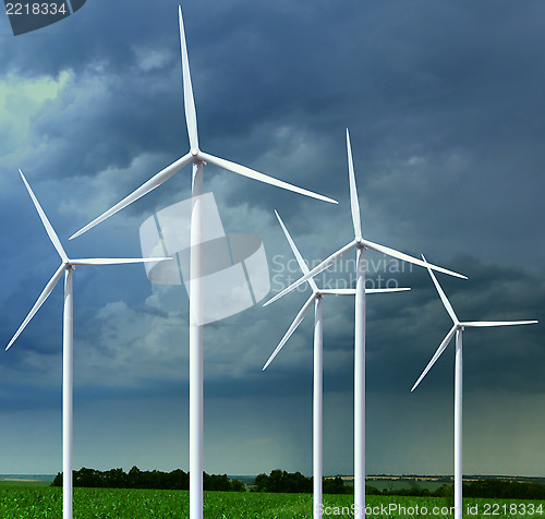 Image of meadow with wind turbines