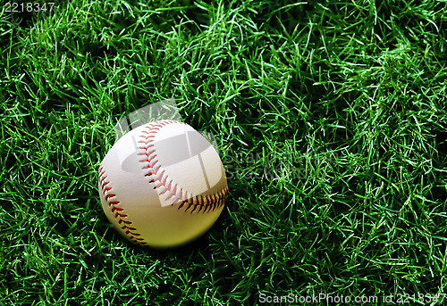 Image of baseball on grass