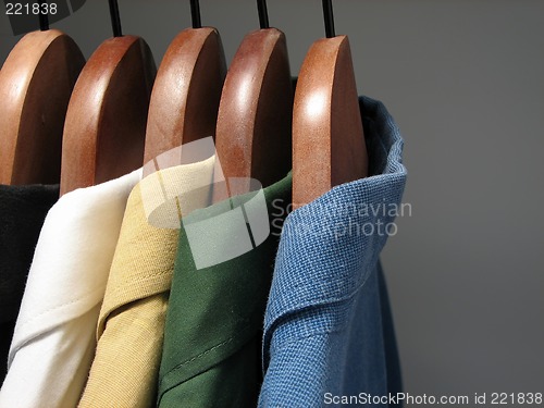 Image of Colorful shirts in a closet