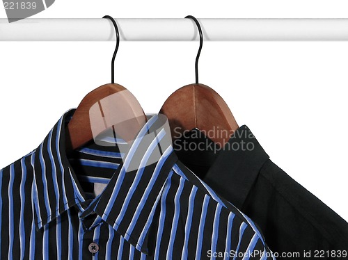 Image of Black and blue shirts on a rack