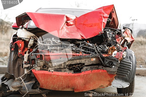 Image of Wrecked car in the city, traffic background