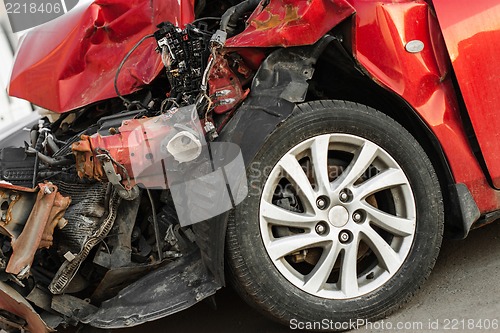 Image of Wrecked car in the city, traffic background