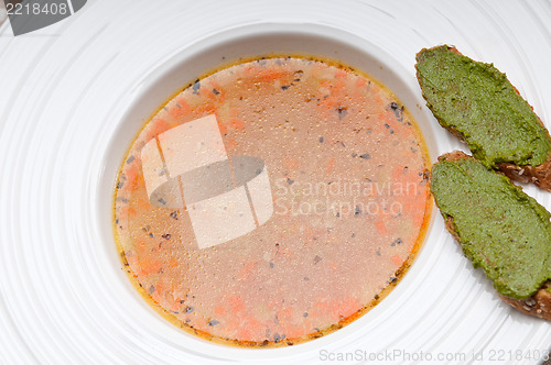 Image of Italian minestrone soup with pesto crostini on side