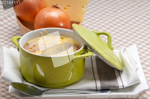 Image of onion soup with melted cheese and bread on top