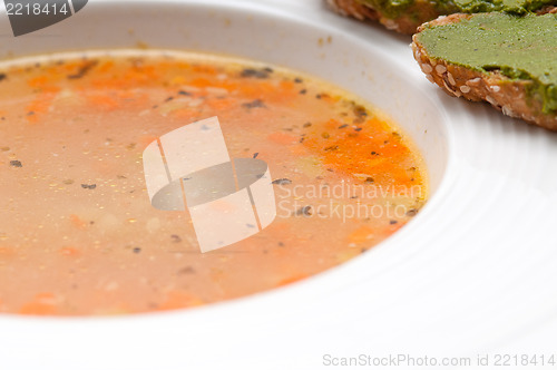 Image of Italian minestrone soup with pesto crostini on side