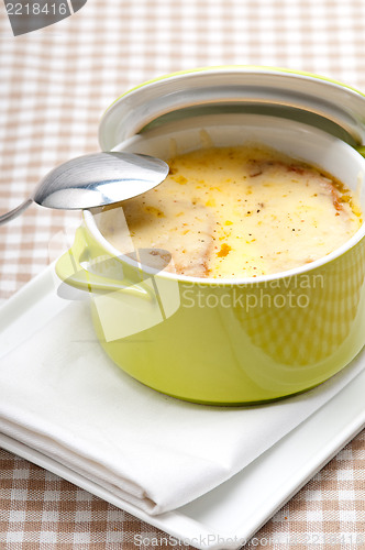 Image of onion soup with melted cheese and bread on top