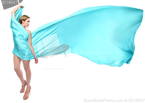 Image of Woman Wrapped in Blue Flowing Fabric
