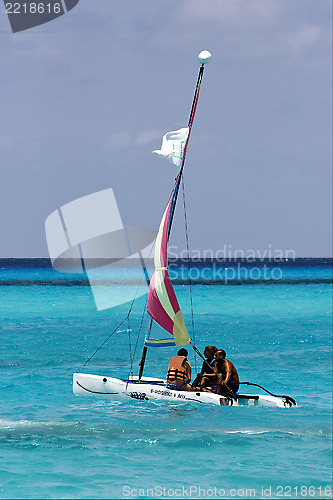 Image of cloudy  catamaran  boat  and coastline in mexico 