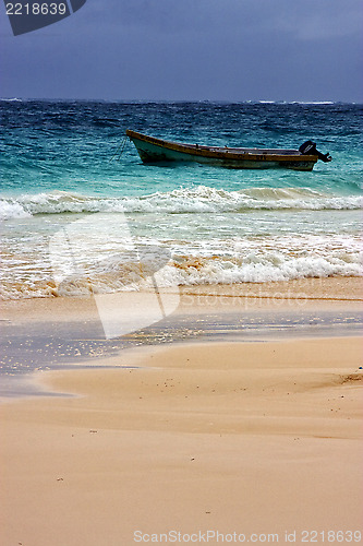 Image of cloudy  motor boat  boat  and coastline in mexico playa del carm