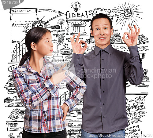 Image of Asian Man and Girl Showing OK