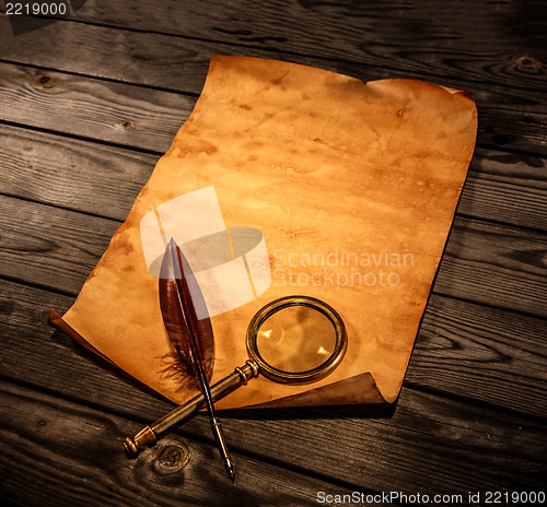 Image of Blank old paper against the background of an aged wood