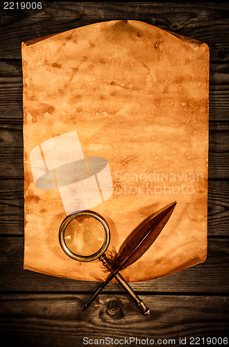 Image of Blank old paper against the background of an aged wood